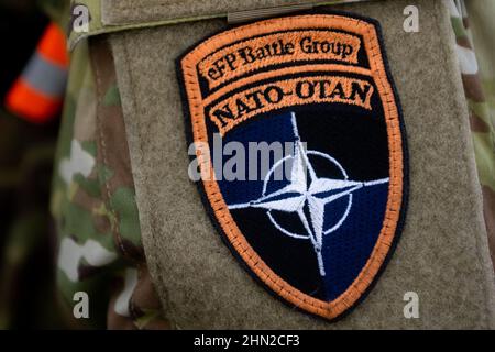 Gdynia, Poland. 13th Feb, 2022. NATO - OTAN eFP Battle Group badge. The US Army transports military equipment from Poland to the United States after being deployed for 9 months, Is the long-term rotation of the equipment. Another unit arrives to train together with the troops of Great Britain, Croatia and Romania as part of joint military maneuvers in Poland and Europe. Credit: SOPA Images Limited/Alamy Live News Stock Photo