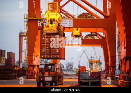 Gdynia, Poland. 13th Feb, 2022. Container seen being loaded on the Navarino Hong Kong container ship at the Baltic Container Terminal in Gdynia. Credit: SOPA Images Limited/Alamy Live News Stock Photo