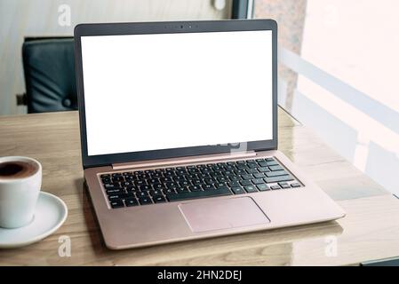 Laptop computer mockup on coffee shop desk. Isolated screen for web site presentation Stock Photo