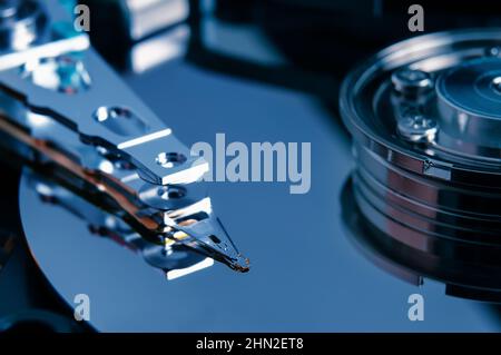 Open hard disk drive with magnetic head closeup. Stock Photo