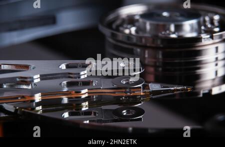 Open hard disk drive with magnetic head closeup. Stock Photo