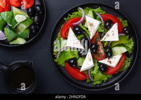 Greek salad with fresh vegetables and feta cheese Stock Photo