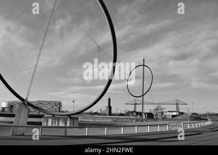 Temenos, an art installation designed by Anish Kapur, with Middlesbrough College and the Transporter Bridge in the background. Stock Photo