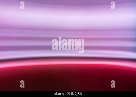 Blurred photo with colorful horizontal lines in pink, lilac, purple. Abstract backdrop. Stock Photo