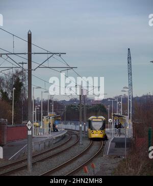 Manchester Metrolink Bombardier Flexity M5000 tram 3030  at Holinwood  tram stop on the off street section Stock Photo