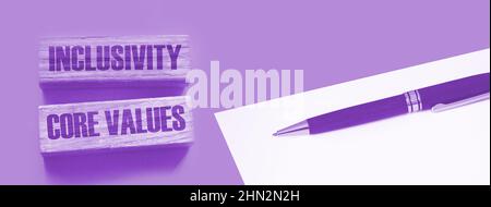 Inclusivity and core values words written on wooden blocks. Social and business concept. Stock Photo