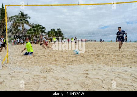 A soccer match on the beach in front of the Caribbean Sea in Playa del Carmen, Mexico. Goal. Stock Photo