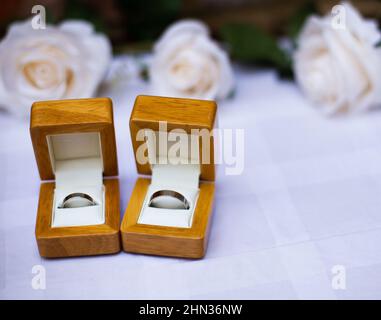 High angle shot of wedding rings in wooden boxes Stock Photo