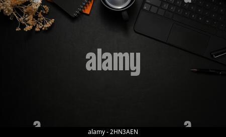 Modern black leather workspace with accessories, wireless keyboard and copy space. top view Stock Photo