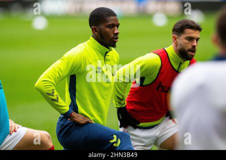 Charlton Athletic’s Daniel Kanu warms up on the pitch ahead of the Sky Bet League One match at the DW Stadium, Wigan. Picture date: Saturday February 12, 2022. Stock Photo