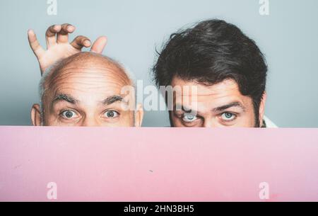 Bold senior man. Bald head. Portrait of a men combing himself. Hair transplantation. Bald man before and after surgery. Help with hair transplant Stock Photo