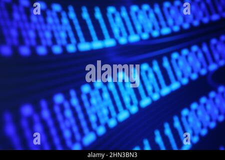 Illustration of running binary codes on a blue blurry background Stock Photo