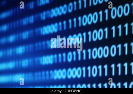 Illustration of running binary codes on a blue blurry background Stock Photo