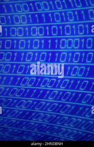 Illustration of running binary codes on a blue blurry background Stock Photo
