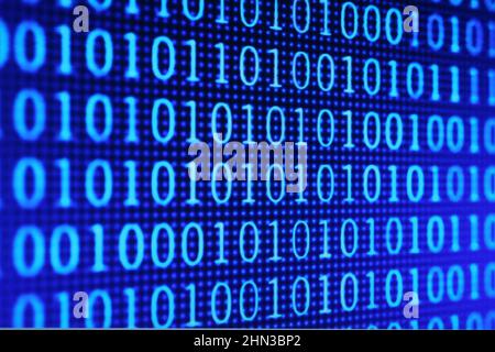 Illustration of running binary codes on a blue blurry background Stock Photo