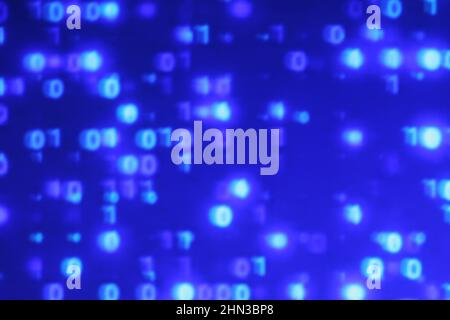 Illustration of running binary codes on a blue blurry background Stock Photo