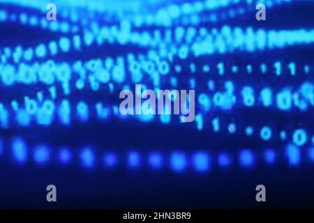 Illustration of running binary codes on a blue blurry background Stock Photo