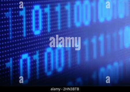 Illustration of running binary codes on a blue blurry background Stock Photo