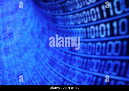 Illustration of running binary codes on a blue blurry background Stock Photo