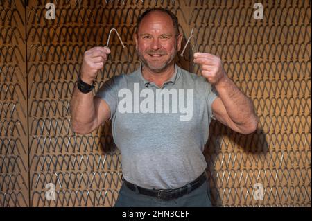 Luxemburg, Luxembourg. 09th Feb, 2021. In his training barn, Georges Christen presents carpenter's nails (7 mm), of which he bent 2000 within 24 hours at the turn of the millennium. The Luxembourger is one of the strongest men in the world: he has 26 entries in the Guinness Book of Records. In just a few seconds, he tears up telephone directories or bends thick nails. (to dpa: Georges Christen: The man who rolls up pans) Credit: Harald Tittel/dpa/Alamy Live News Stock Photo