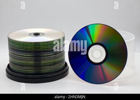 A stack of CDs on spool isolated on white background. Pile of compact disc. Stock Photo