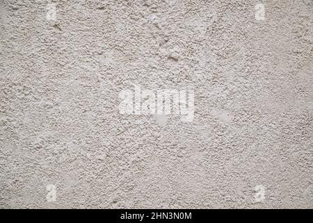 The wall is covered with gray decorative plaster Stock Photo