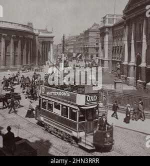 Vintage photo of Trinity College (right), Bank of Ireland and old Parliament House (left). Dublin, Ireland. 1900s Stock Photo