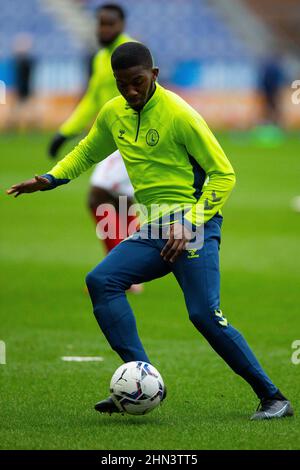 Charlton Athletic’s Daniel Kanu warms up on the pitch ahead of the Sky Bet League One match at the DW Stadium, Wigan. Picture date: Saturday February 12, 2022. Stock Photo