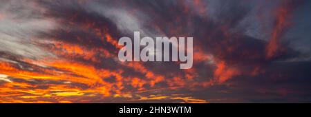 Panorama of the sky during a dramatic sunset Stock Photo