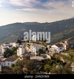 Canillas de Albaida, Spain - 13 February, 2022: small village in the backcountry of Andalusia with whitewashed houses and a chapel on the hill Stock Photo