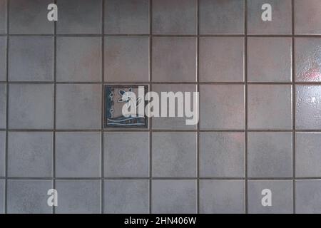 Old tiles with decor on the background. Light tiled wall. High quality photo Stock Photo
