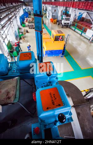 Karagandy, Kazakhstan-June 08,2012: KazBELAZ quarry trucks BELAZ service and repairing plant. Close up of operator workplace in crane cabin. Control l Stock Photo