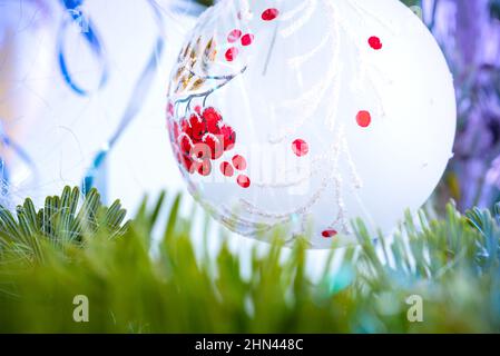 Christmas tree background and Christmas decorations, blurred, sparking, glowing. Happy New Year and Xmas theme Stock Photo