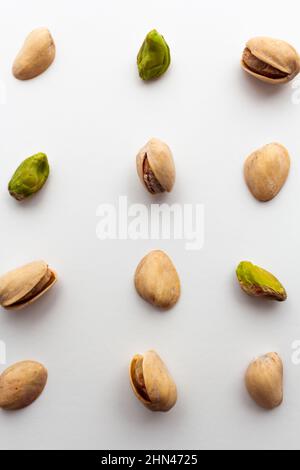 Pattern of roasted pistachios isolated on white background. Stock Photo