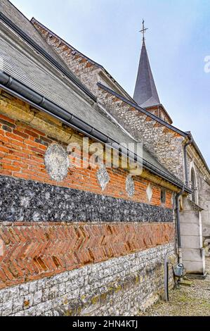 The mix of flint stone from the beach and red brick is characteristic for the architecture of  Le Tlleul,  Pays de Caux, France Stock Photo