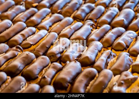 Close-up eclairs cake. Freshly made eclair cake in tray Stock Photo