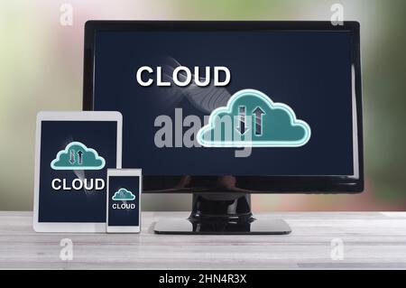 Cloud concept shown on different information technology devices Stock Photo