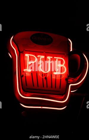 a red neon sign shaped like a beer mug with the word "PUB" in Pigalle, Paris, France Stock Photo