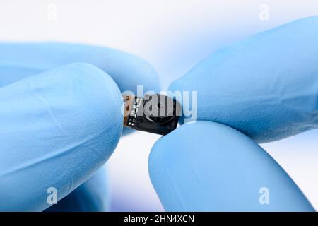 Camera module in scientist hands. Stock Photo