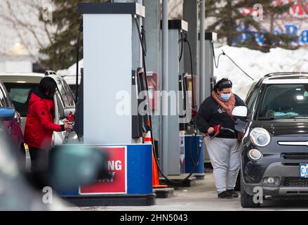 Toronto, Canada. 13th Feb, 2022. People fuel their vehicles at a gas station in Toronto, Canada, on Feb. 13, 2022. The regular gas price of the Greater Toronto Area hit a record high on Sunday to 1.609 Canadian dollars per litre, according to local media. Credit: Zou Zheng/Xinhua/Alamy Live News Stock Photo