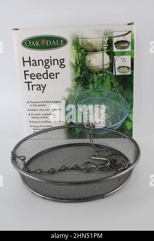 Hanging bird feeder tray, prevents bird seed from dropping on the ground. Stock Photo