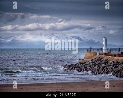 Winter view looking towards Isle of Arran sonw capped peaks from the beach at Ayr. Stock Photo