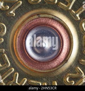 A pierced primer in a 12 gauge case from a hunting rifle. macro photography Stock Photo