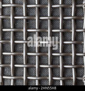 Double metal grille of different density on the microphone ear pad. Macro. Stock Photo
