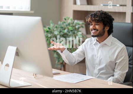 A young businessman having a video call and looking involved Stock Photo