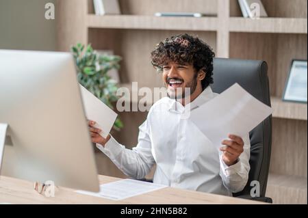A young businessman having a video call and looking involved Stock Photo