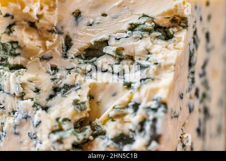 Blue cheese close up. Fungal mold texture background. Stilton, gorgonzola, roquefort. Stock Photo