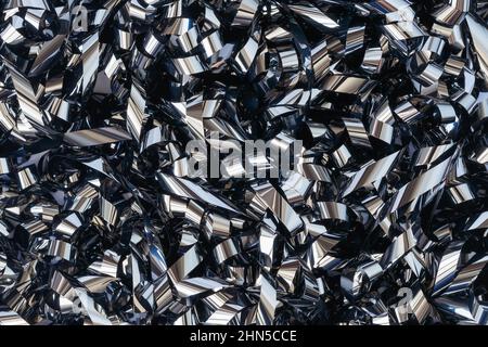 Abstract background of twisted metallized tape from an analog recorder Stock Photo