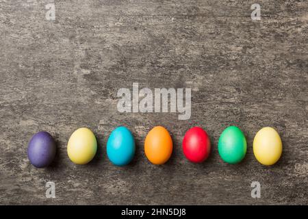 holiday preparation Multi colors Easter eggs on colored background . Pastel color Easter eggs. holiday concept with copy space. Stock Photo