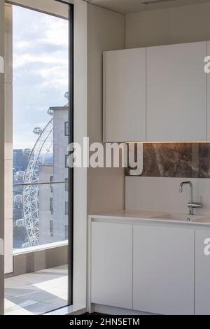 14th floor apartment kitchen and window view. 8-13 Casson Square, London, United Kingdom. Architect: Patel Taylor Architects, 2022. Stock Photo